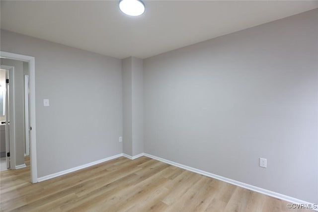 spare room featuring light hardwood / wood-style floors