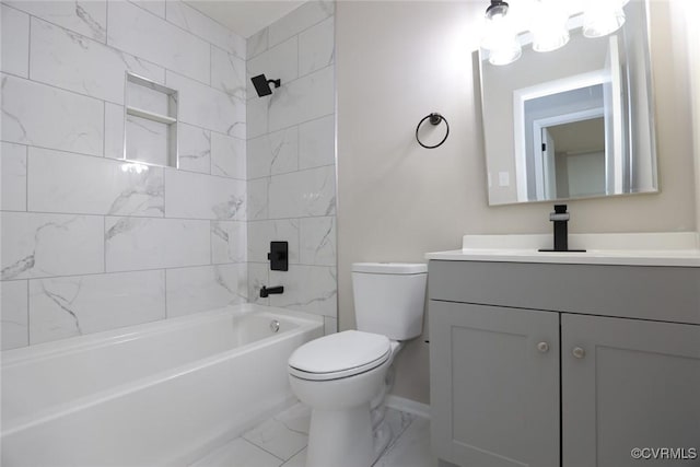 full bathroom featuring toilet, vanity, and tiled shower / bath