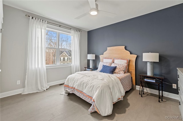 bedroom featuring ceiling fan and light hardwood / wood-style floors