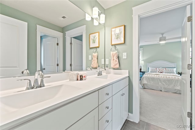 bathroom with ceiling fan, vanity, and tile patterned flooring