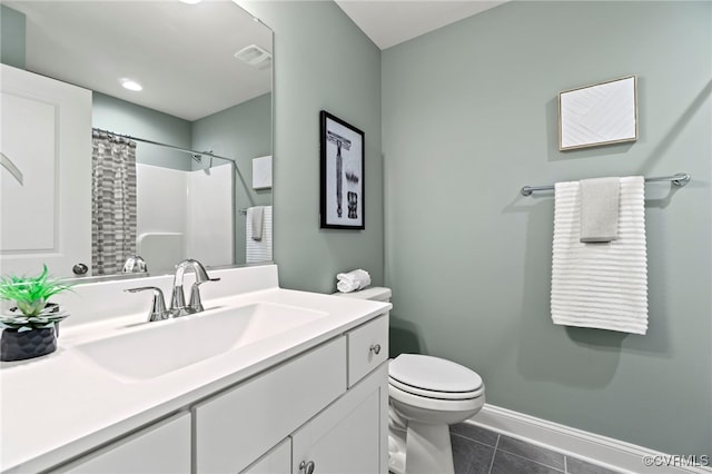 bathroom featuring toilet, vanity, a shower with curtain, and tile patterned floors