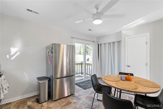 dining space featuring ceiling fan