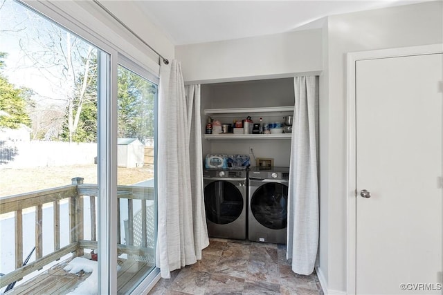 laundry area featuring washing machine and clothes dryer