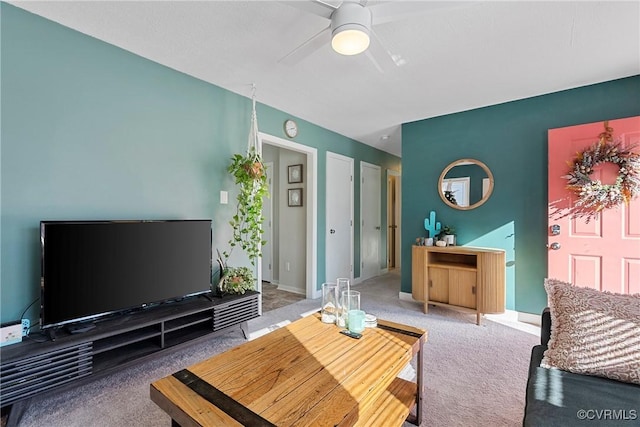 living room with ceiling fan and light colored carpet