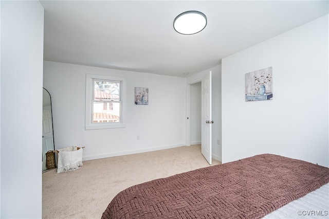 bedroom with light colored carpet