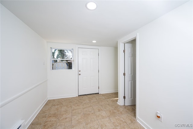 entryway featuring a baseboard heating unit