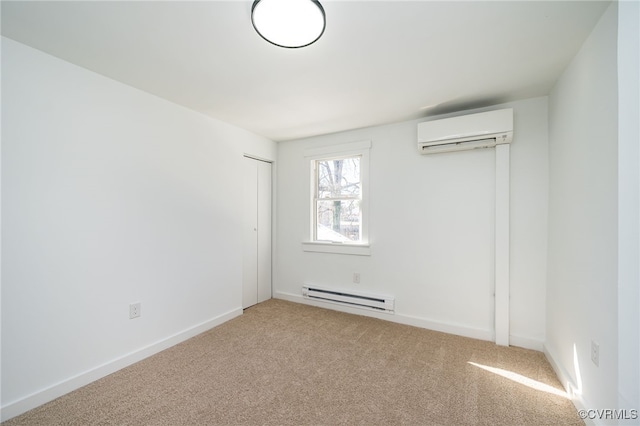 carpeted spare room featuring a baseboard radiator and a wall unit AC