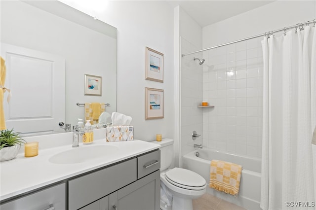 full bathroom featuring shower / bath combo with shower curtain, tile patterned floors, toilet, and vanity