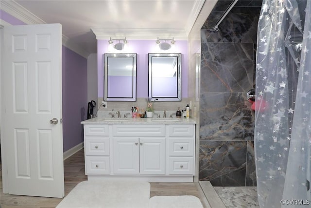 bathroom featuring a shower with shower curtain, crown molding, hardwood / wood-style flooring, and vanity