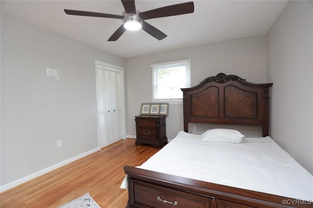 bedroom with ceiling fan, hardwood / wood-style flooring, and a closet