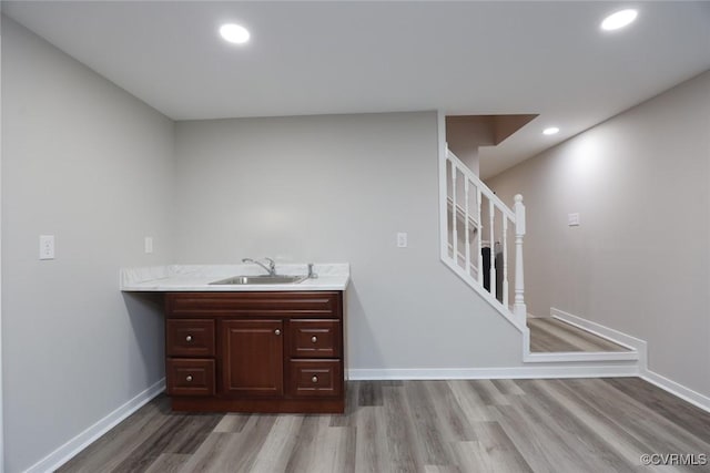 bathroom with vanity and hardwood / wood-style floors