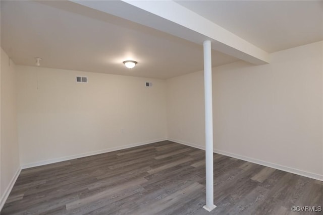 basement featuring dark wood-type flooring