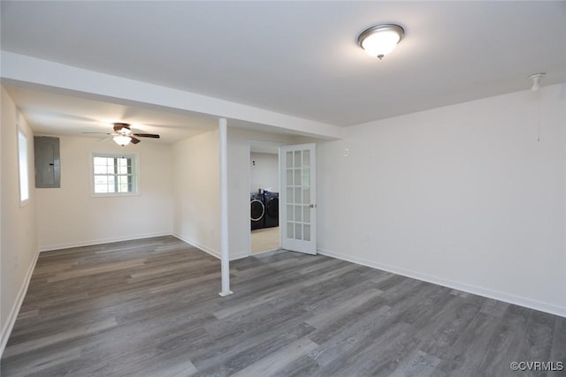 basement with dark hardwood / wood-style flooring, french doors, independent washer and dryer, ceiling fan, and electric panel