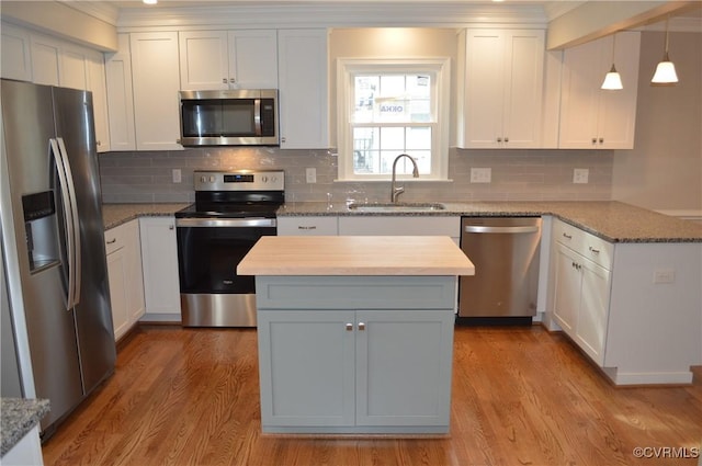 kitchen featuring sink, white cabinets, and stainless steel appliances