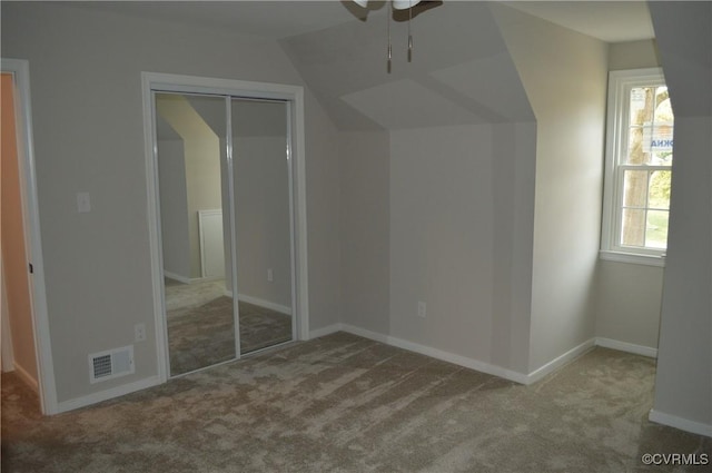 additional living space with ceiling fan and carpet flooring