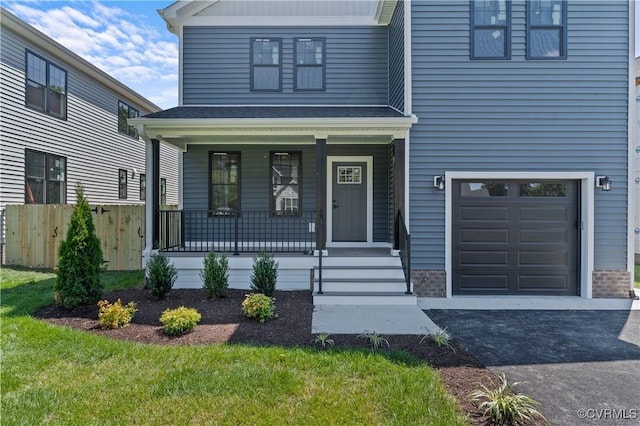 view of front of house with a porch and a garage