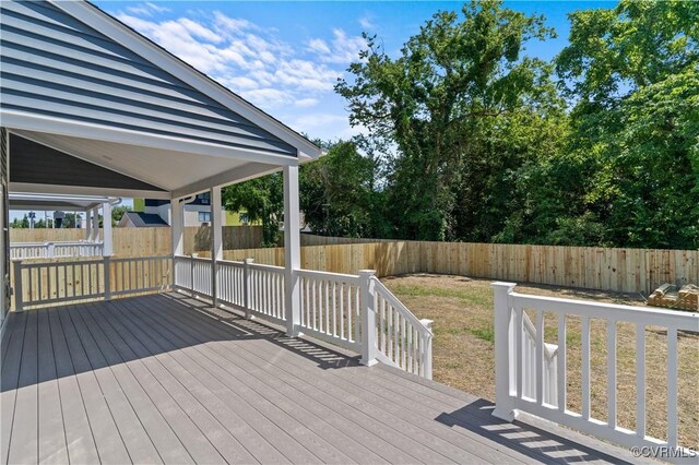 wooden terrace with a yard