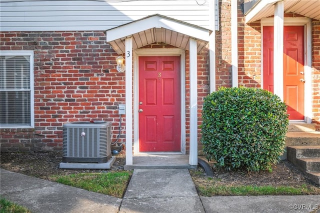 entrance to property featuring central AC