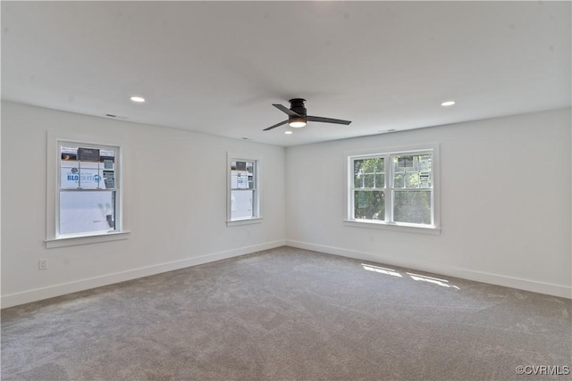 unfurnished room with carpet and ceiling fan