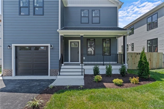 view of front of house with covered porch and a garage