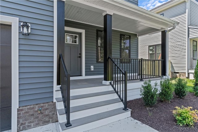 doorway to property with covered porch