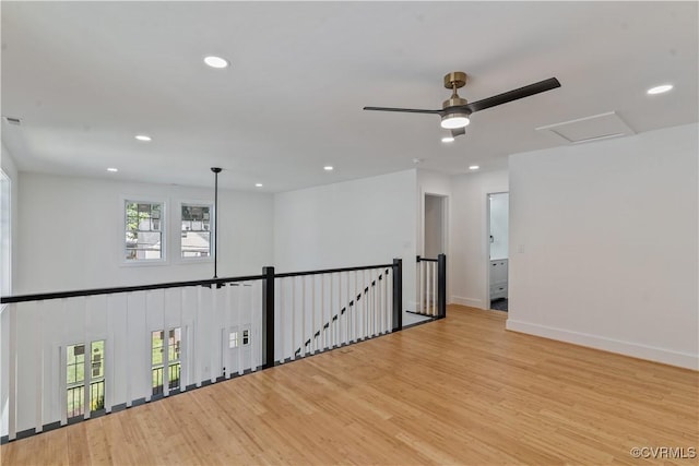 spare room featuring ceiling fan and light wood-type flooring