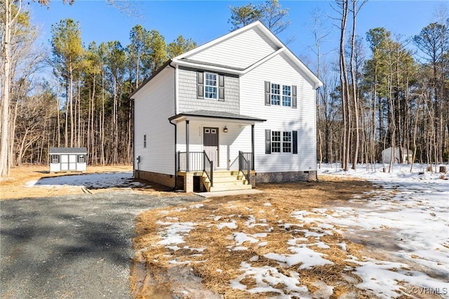 front of property featuring a storage unit