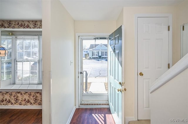 doorway to outside with dark hardwood / wood-style flooring