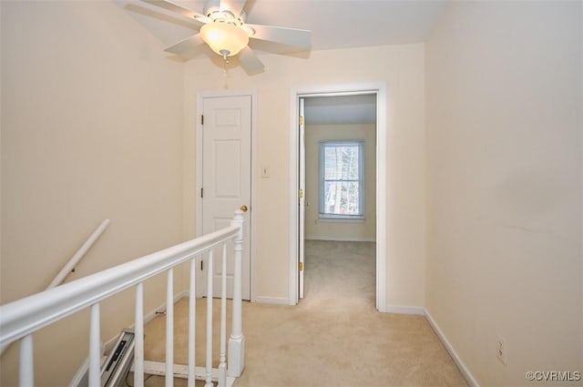 corridor with light colored carpet