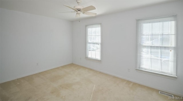 carpeted empty room with ceiling fan