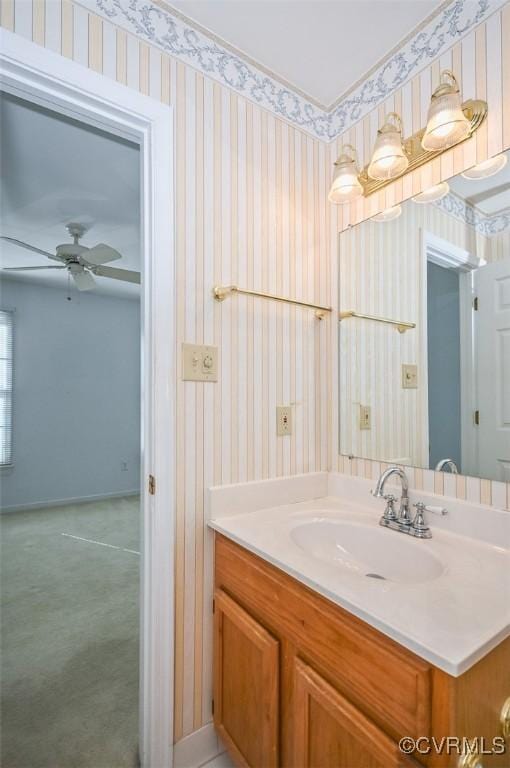 bathroom with ceiling fan and vanity