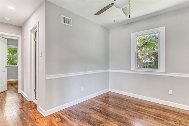 unfurnished room featuring ceiling fan and hardwood / wood-style floors