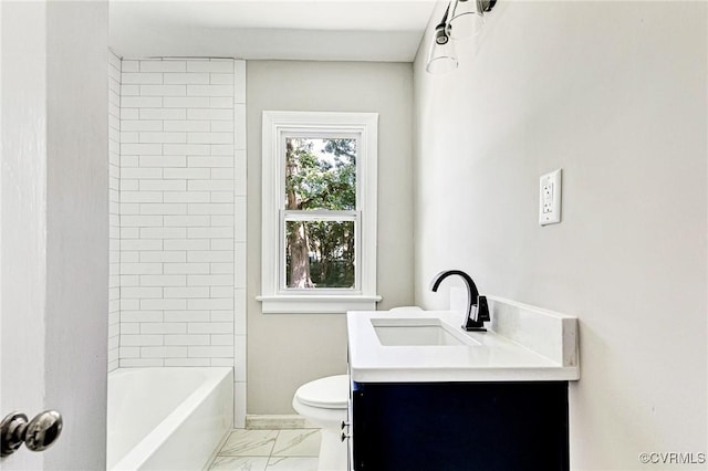 full bathroom featuring toilet, tiled shower / bath, and vanity