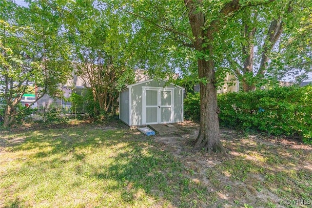 view of outbuilding featuring a lawn