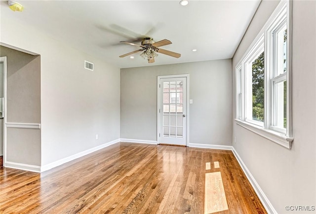 spare room featuring ceiling fan and light hardwood / wood-style floors