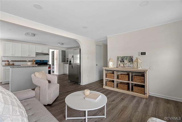 living room featuring dark hardwood / wood-style flooring and electric panel