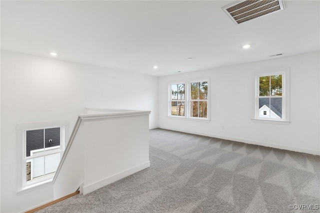 carpeted spare room with plenty of natural light