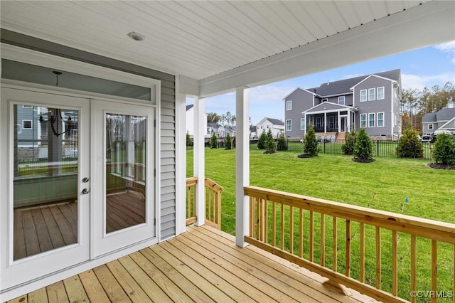 wooden terrace with a lawn