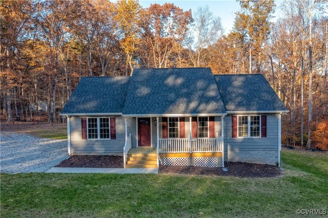 view of front facade with covered porch and a front lawn