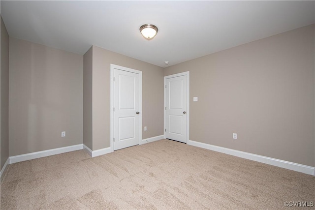 unfurnished bedroom featuring a closet and carpet flooring