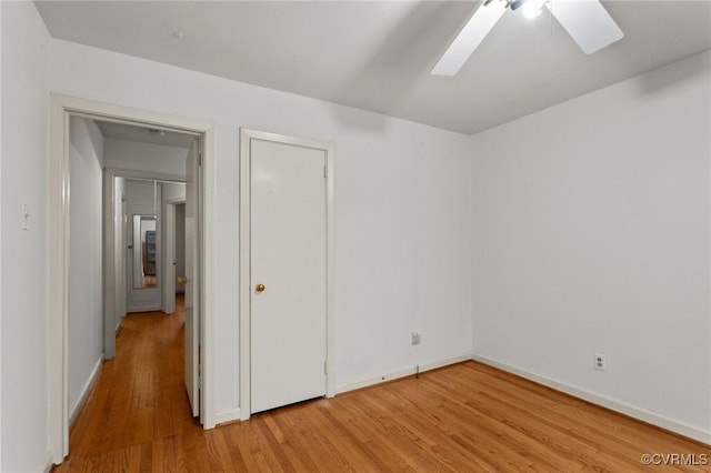 unfurnished room featuring ceiling fan and light hardwood / wood-style floors