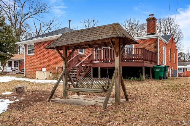 rear view of house with a deck