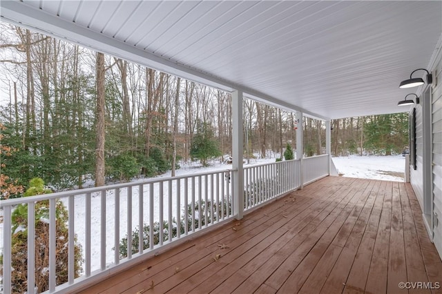 view of snow covered deck