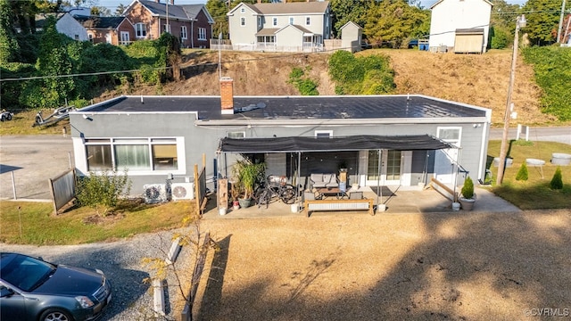 rear view of house featuring a patio