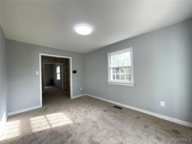 unfurnished room featuring carpet flooring