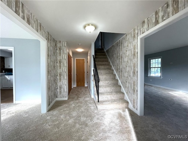 stairs featuring carpet