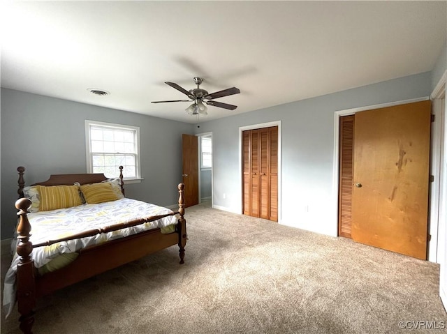 bedroom featuring ceiling fan and carpet