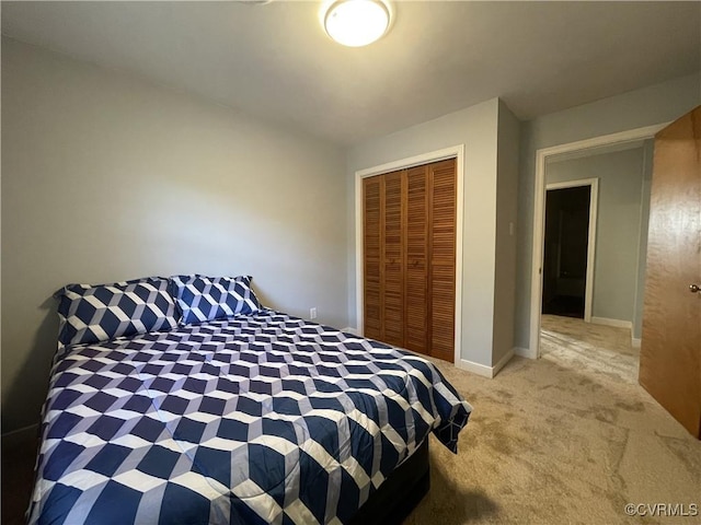 bedroom with light colored carpet and a closet