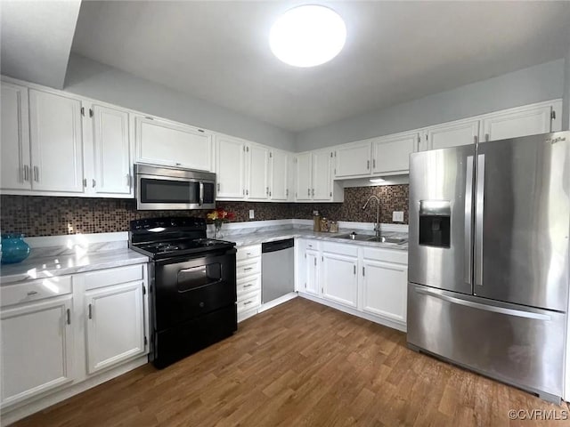 kitchen featuring sink, white cabinetry, and stainless steel appliances