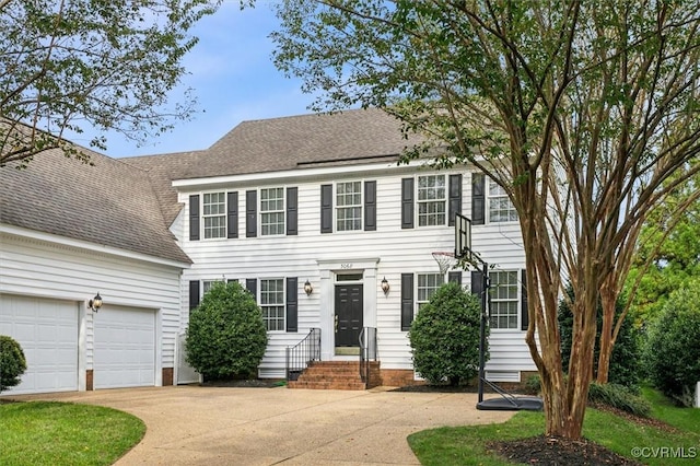 colonial inspired home with a garage